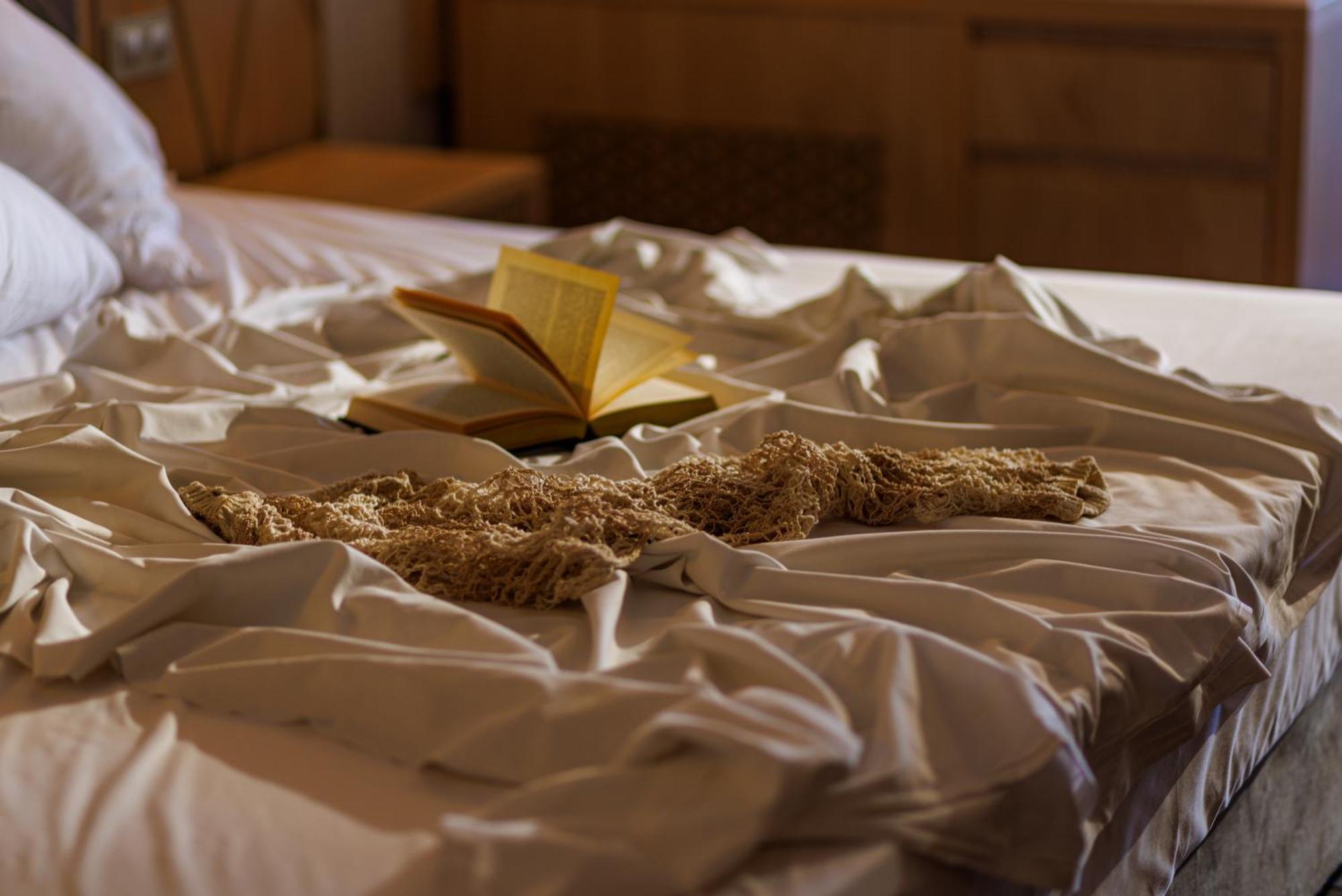Secrets Sunny Beach Resort & Spa (Adults Only) Екстер'єр фото A bed with a book and a cat